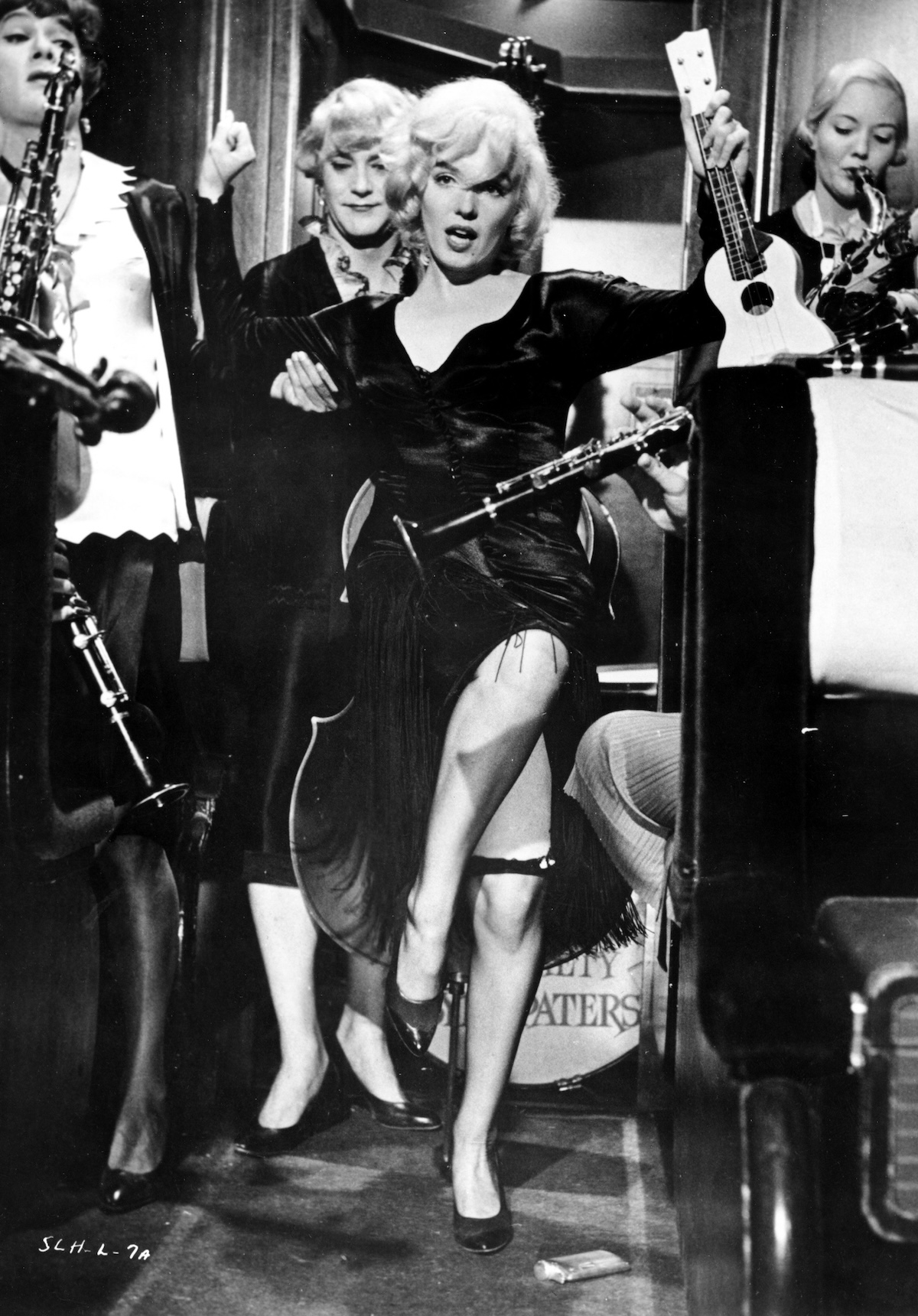 Actors Marilyn Monroe, Jack Lemmon and Tony Curtis perform a scene in movie, Some Like It Hot, directed by Billy Wilder, 1959